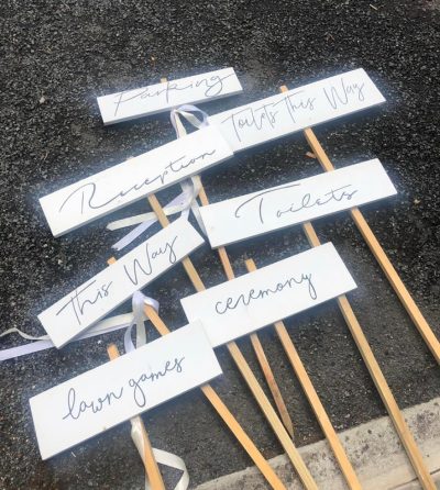 White wedding sign posts