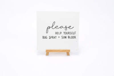 White wooden sign- Sunscreen + Bug Spray sign
