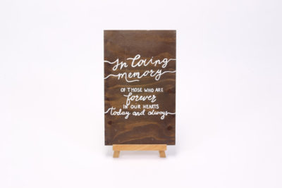 Dark wooden sign- "In Loving memory"