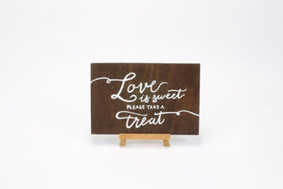 Dark wooden sign- "Love is sweet please take a treat"