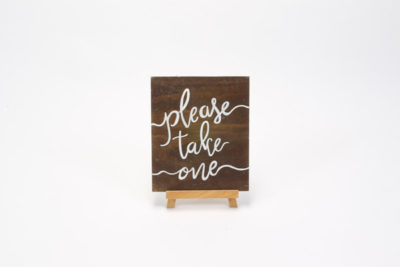 Dark wooden sign- "Please take one"